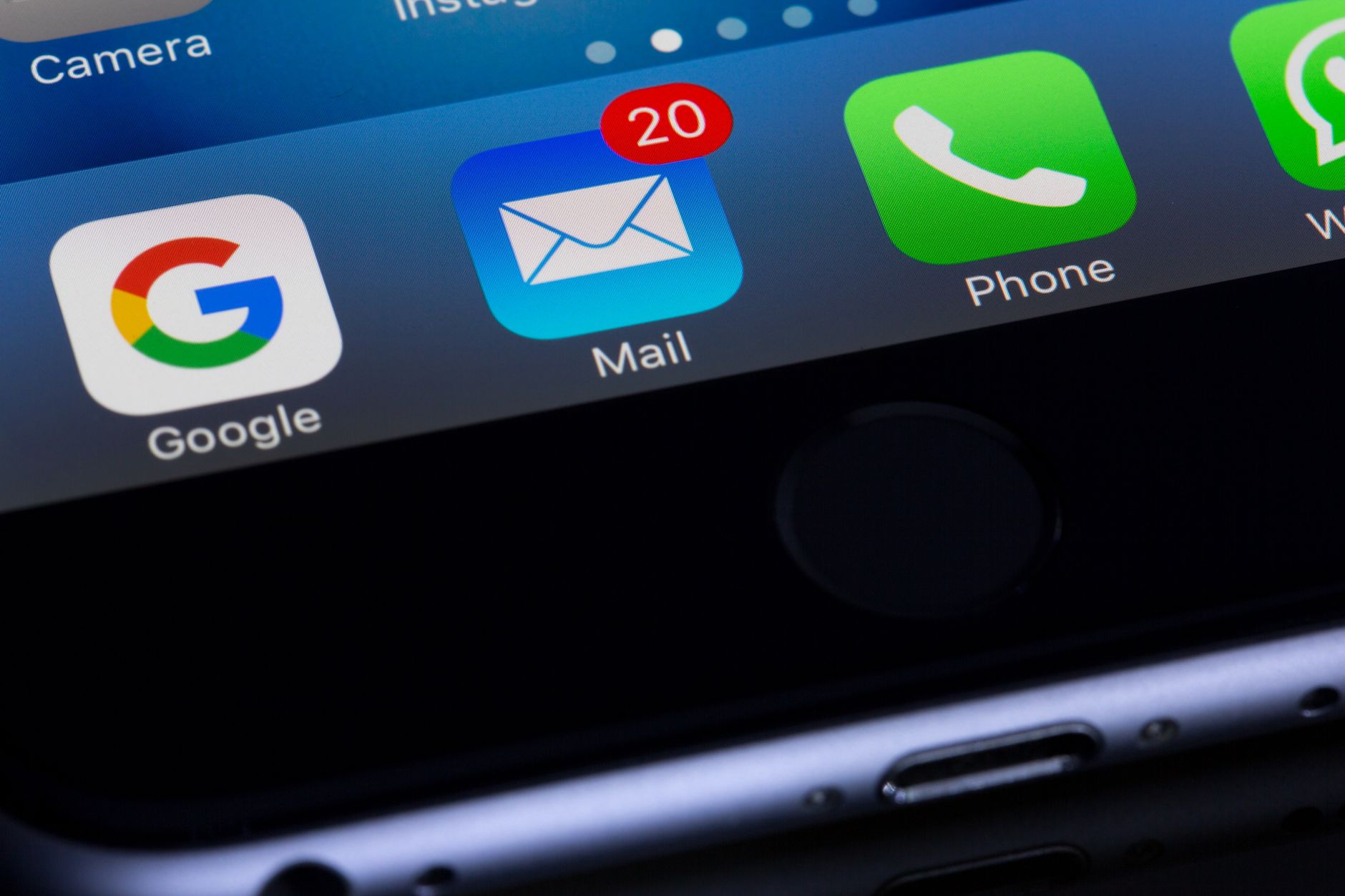iPhone home screen showing Google, Mail with 20 unread messages, Phone, and Camera app icons