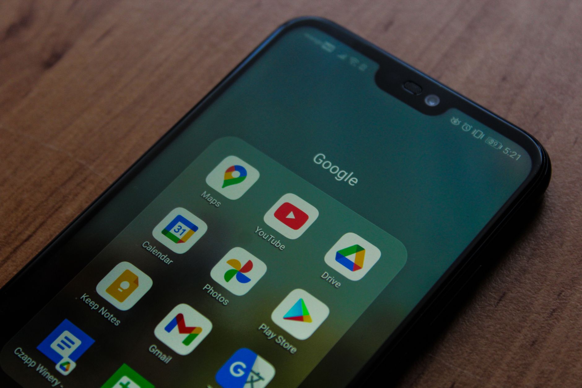 Android phone displaying Google apps including Maps, Calendar, Keep Notes, YouTube, Photos, Gmail, Drive, and Play Store